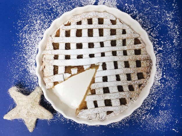 High angle view of sweet pie on blue table