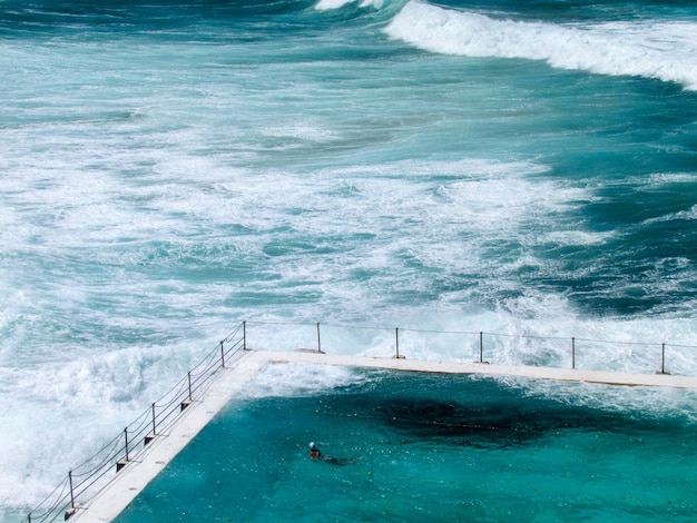 High angle view of swimming pool by sea