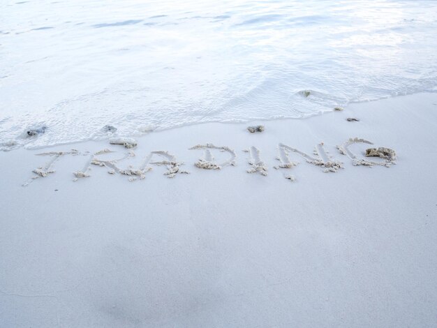 High angle view of text on beach