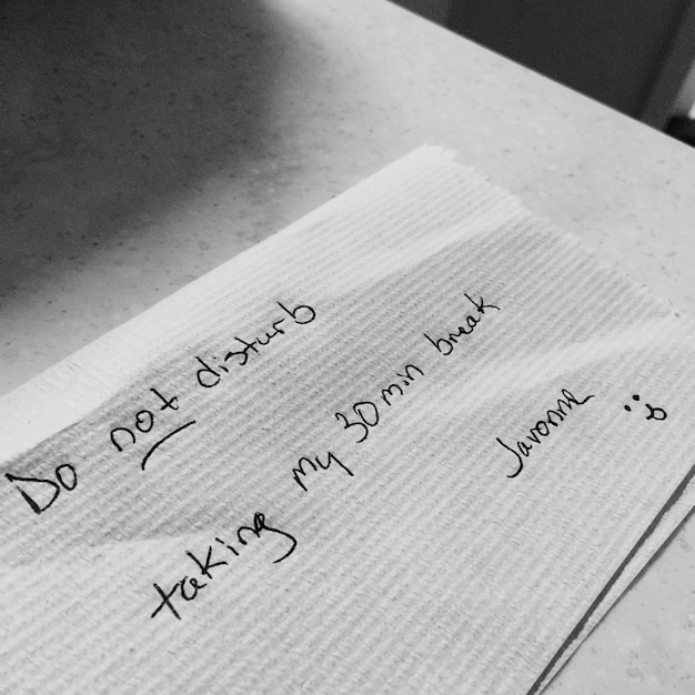high angle view of text on paper at table