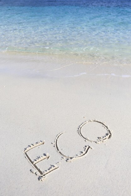 Photo high angle view of text on sand at beach