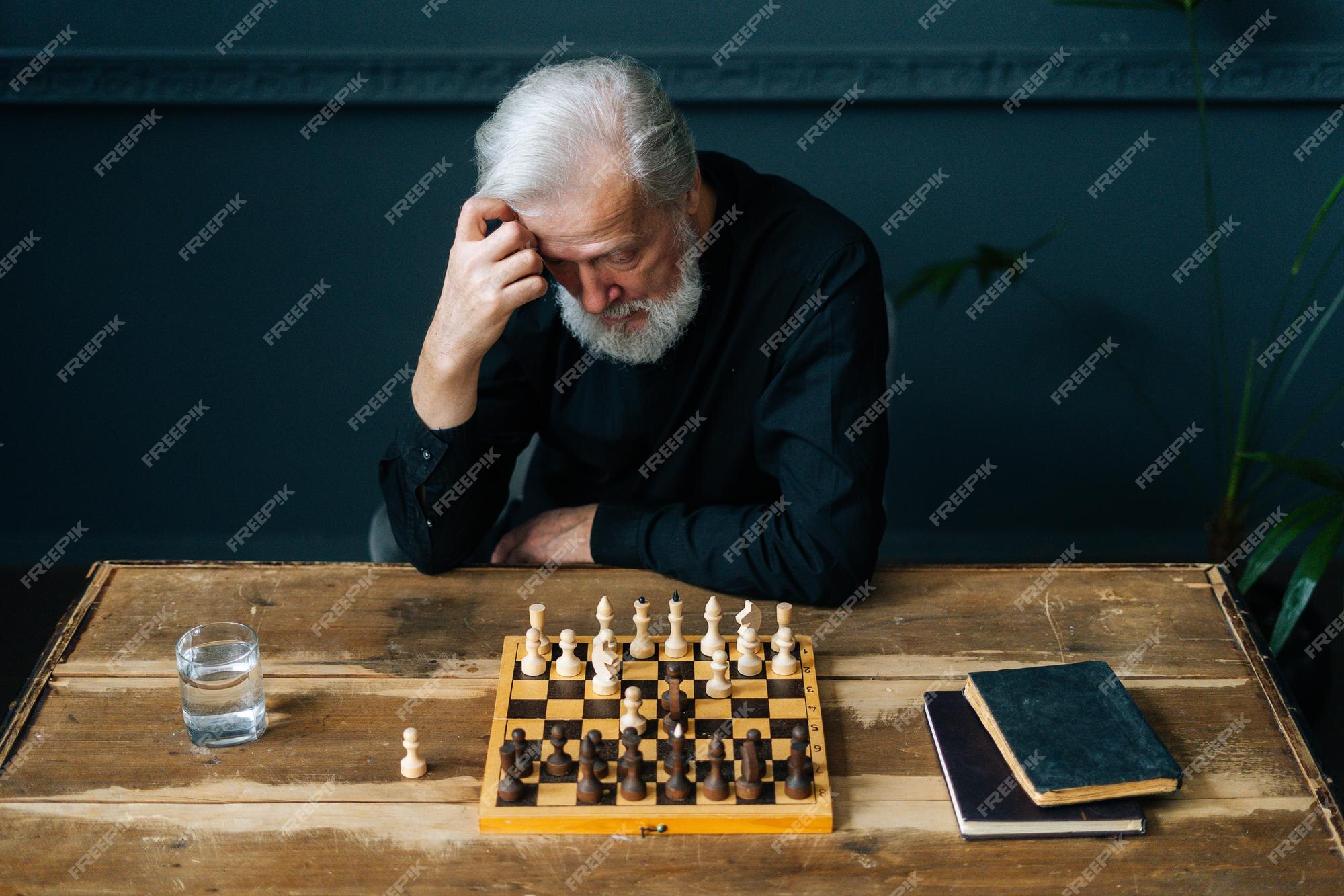 Senior Man Contemplating On His Next Move In Chess Game Stock Photo,  Picture and Royalty Free Image. Image 39013564.