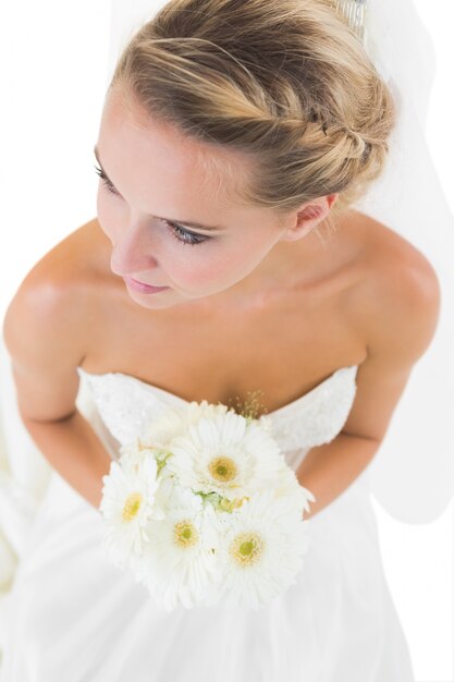 High angle view of thoughtful bride carrying a bouquet