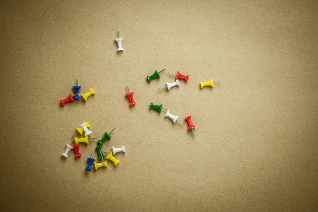 High angle view of thumbtacks on table