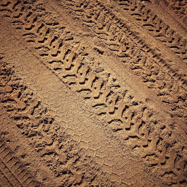 High angle view of tire track on sand