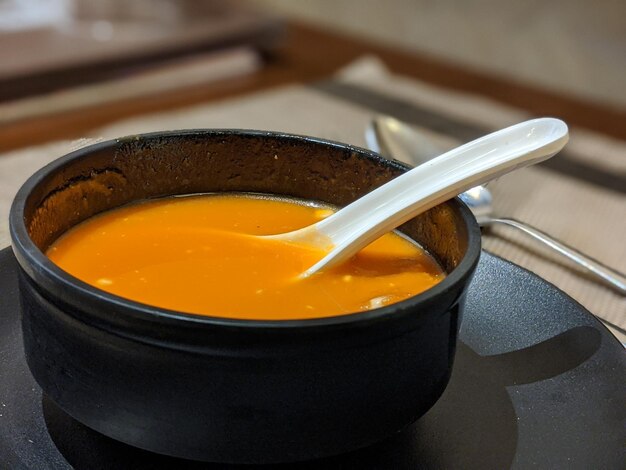 High angle view of tomato soup in a bowl on table