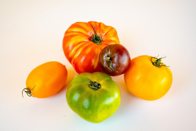 High angle view of tomatoes against white background