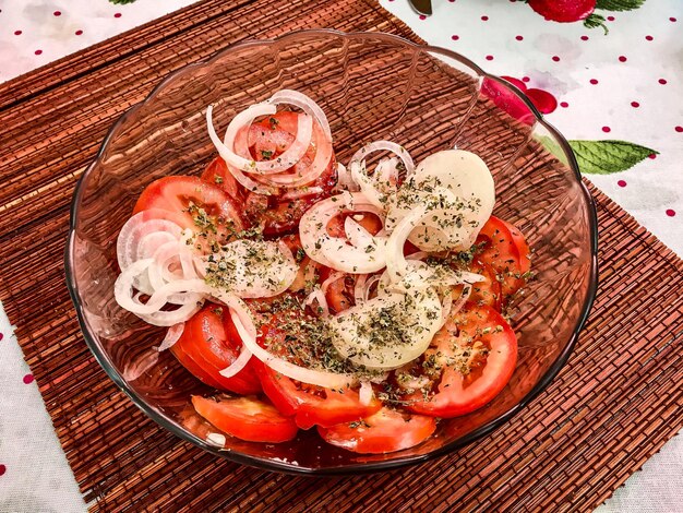 High angle view of tomatoes salad in bowl on table