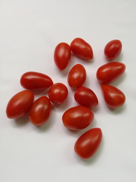 High angle view of tomatoes over white background