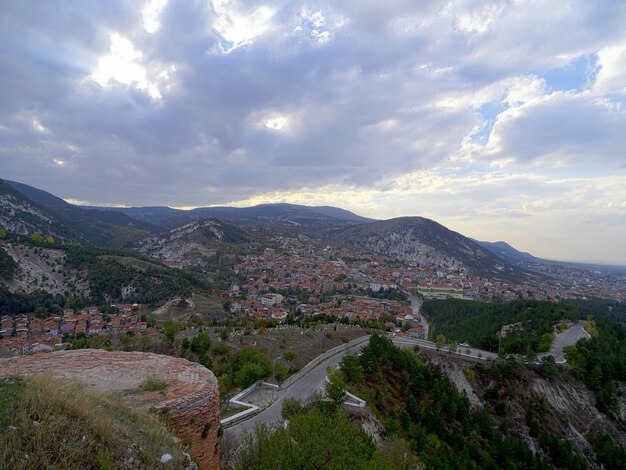 High angle view of town against cloudy sky