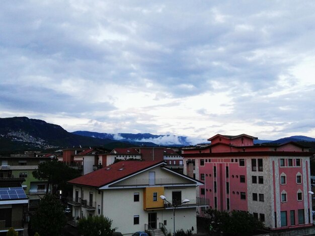 High angle view of town against cloudy sky