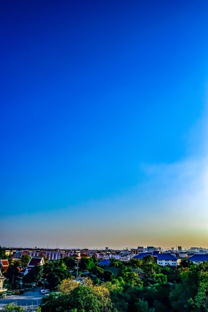 High angle view of townscape against blue sky