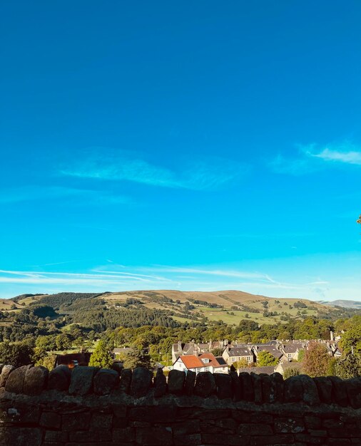 High angle view of townscape against blue sky