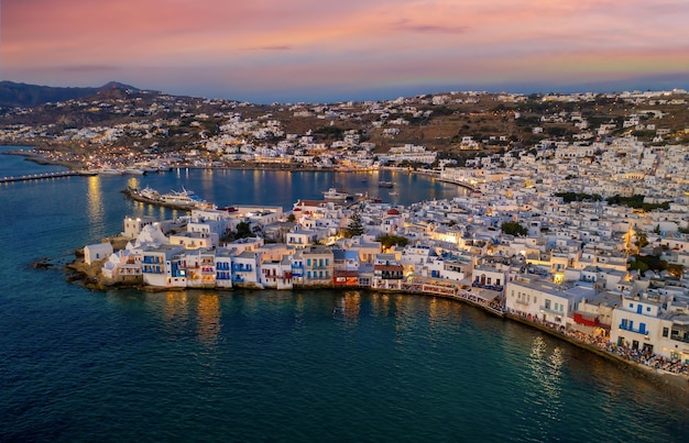 high angle view of townscape by sea against sky