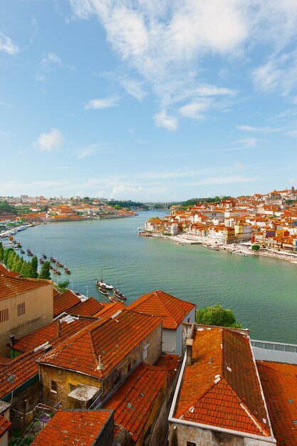 High angle view of townscape by sea against sky