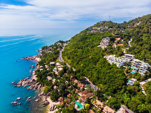 High angle view of townscape by sea against sky