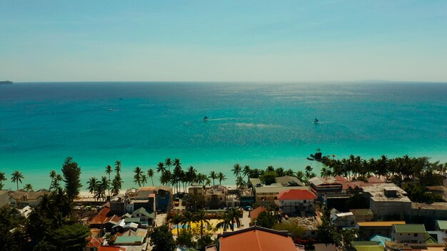 High angle view of townscape by sea against sky