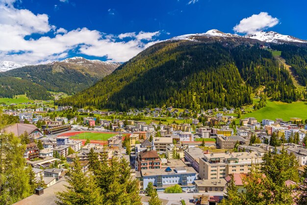 High angle view of townscape and mountains against sky