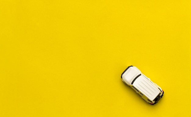 High angle view of toy car on yellow background