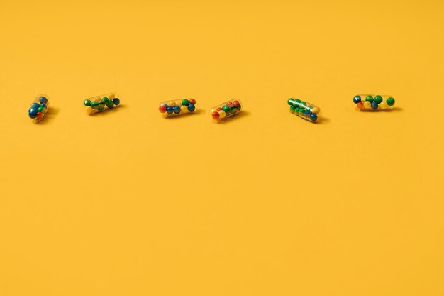 High angle view of toy cars on yellow background