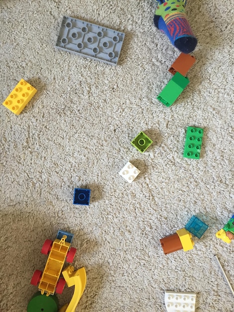 Photo high angle view of toys on carpet