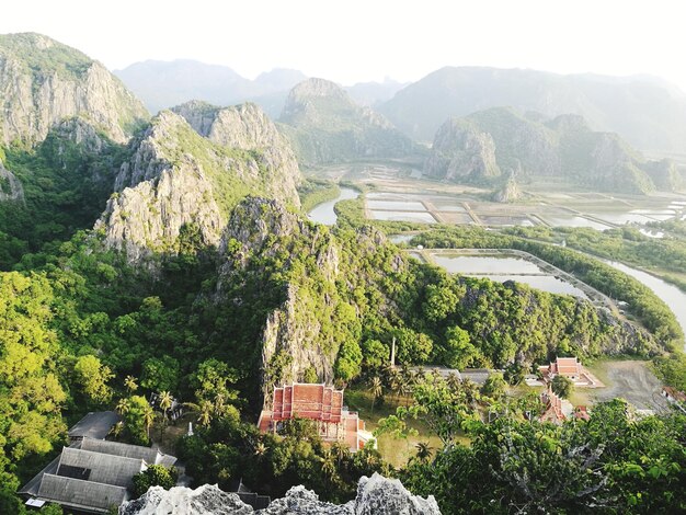 High angle view of trees and mountains against clear sky