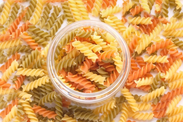 Photo high angle view of uncooked macaroni in a jar