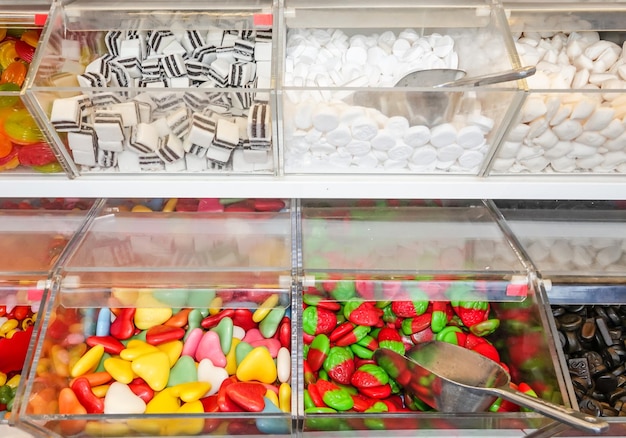 Photo high angle view of various candies on display at store