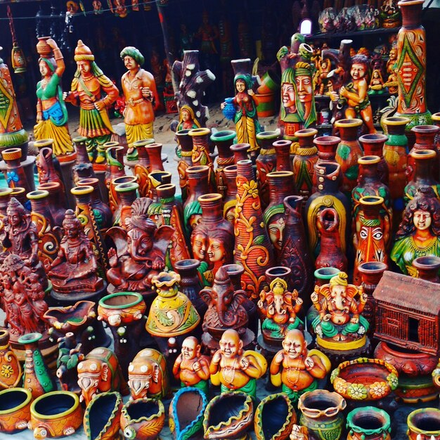 high angle view of various figurines displayed at market stall