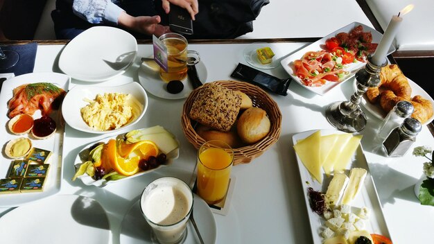 High angle view of various food on table for breakfast