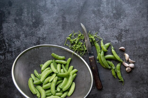 High angle view of vegetables in bowl against black background