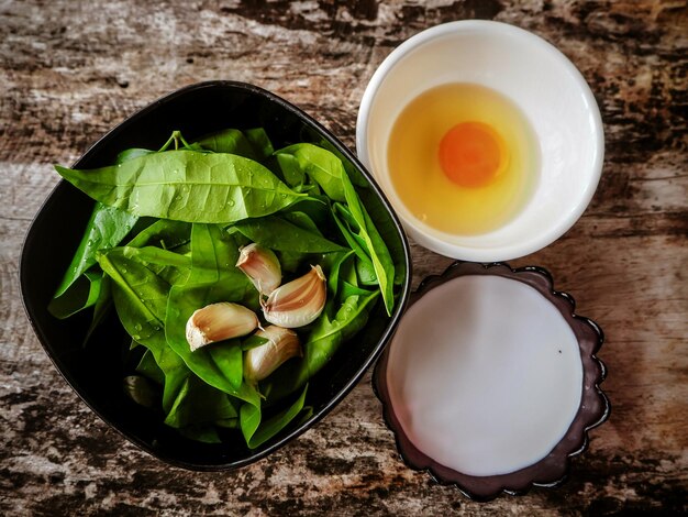 High angle view of vegetables and leaves on table