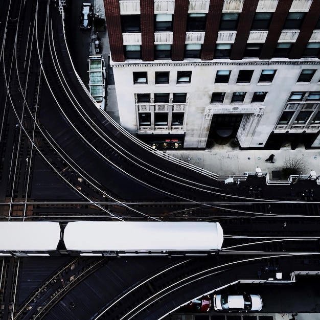 High angle view of vehicles on road amidst buildings