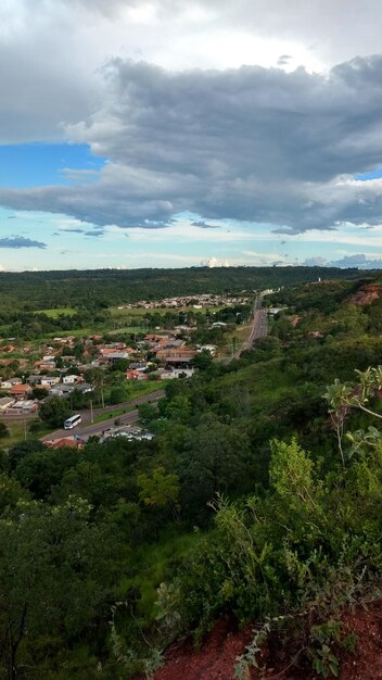 High angle view of vineyard in town against sky