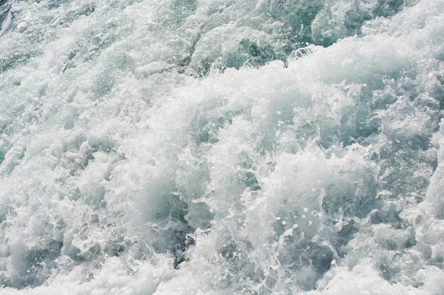 High angle view of waves splashing in sea