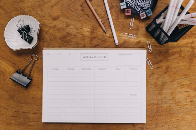 High angle view of a weekly planner on a wooden table