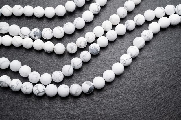 High angle view of white beads on table