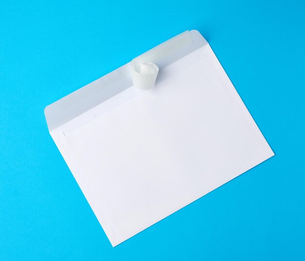 High angle view of white paper against blue background