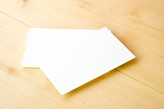 High angle view of white paper on wooden table