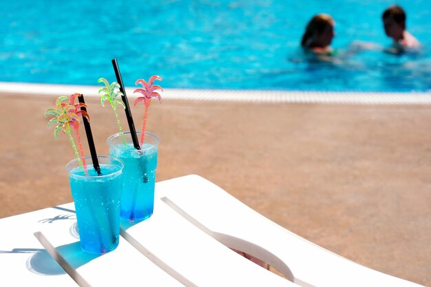 High angle view of wine glasses in swimming pool