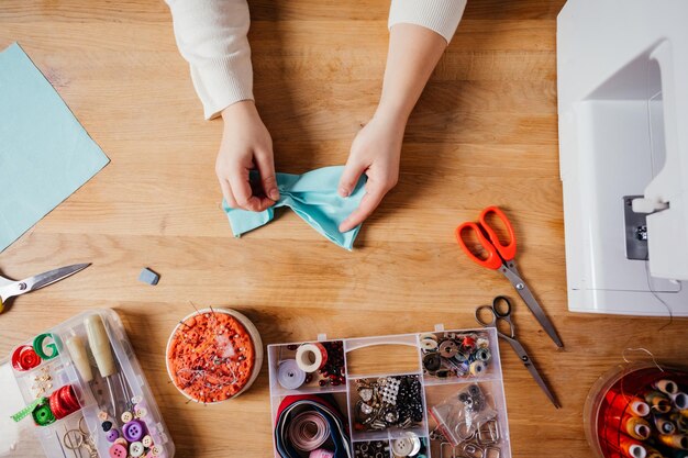 High angle view of woman holding food on table