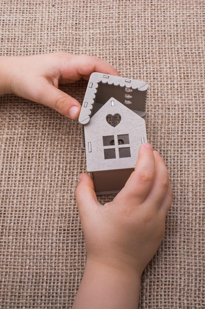 High angle view of woman holding hands in house