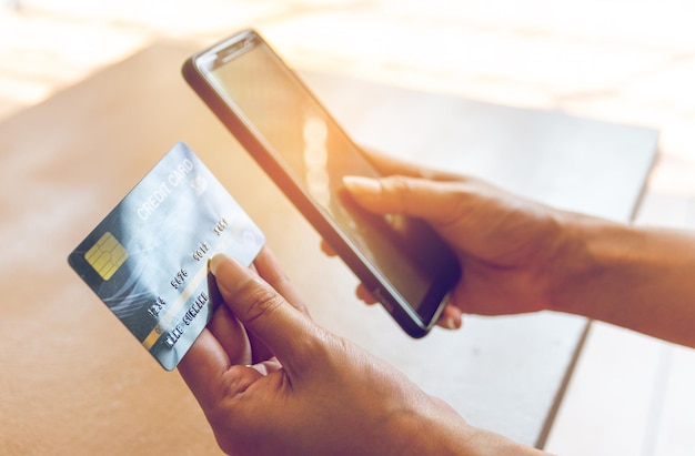 High angle view of woman holding mobile phone