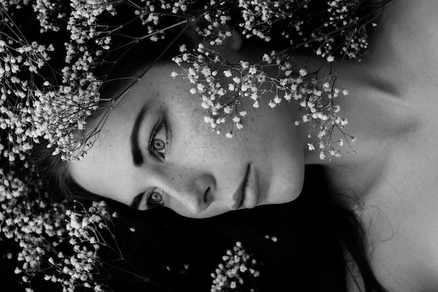 High angle view of woman lying down amidst plants