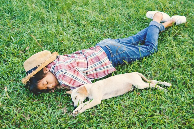 High angle view of woman lying down on grass