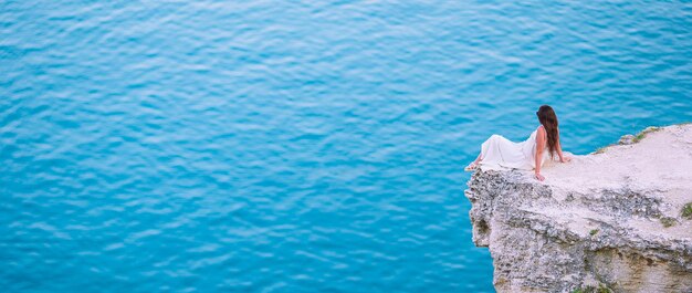 High angle view of woman relaxing in swimming pool