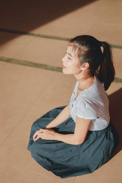 high angle view of woman sitting on floor