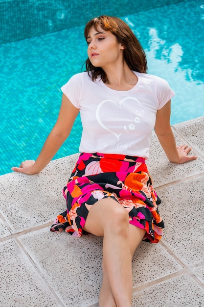 Photo high angle view of woman sitting in swimming pool