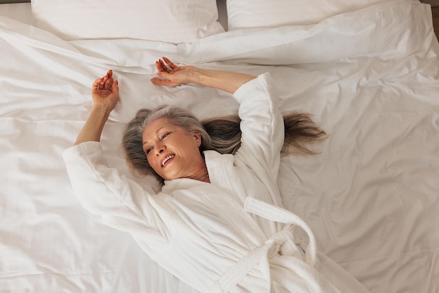 high angle view of woman sleeping on bed at home