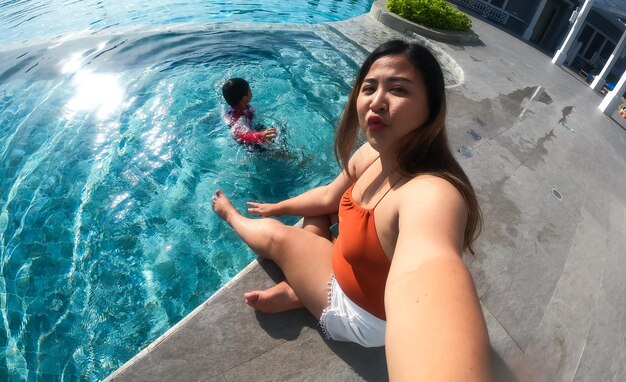 High angle view of woman swimming in pool